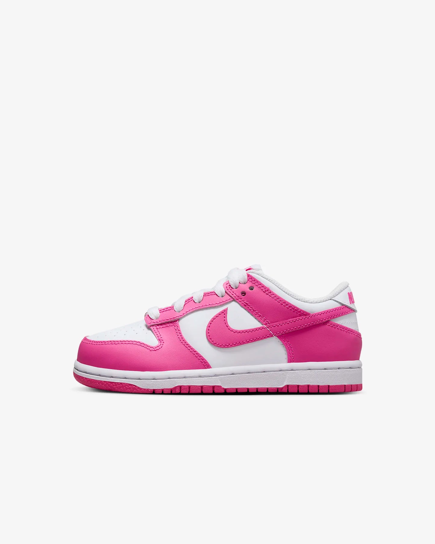 A pair of kids' Dunk Low sneakers in white and pink