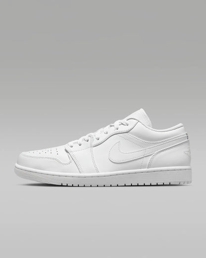 A pair of Jordan 1 Low sneakers with a white color scheme.