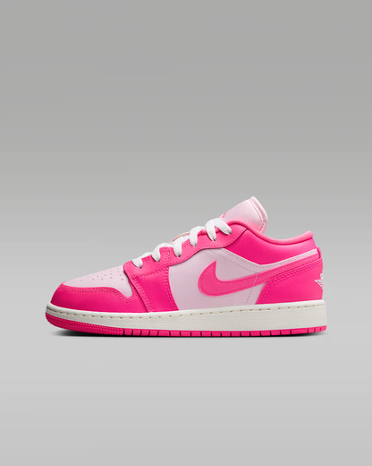 Pink and white sneaker on a gray background
