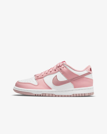 A customized Big Kids' Dunk Low primarily in pink and white colors.