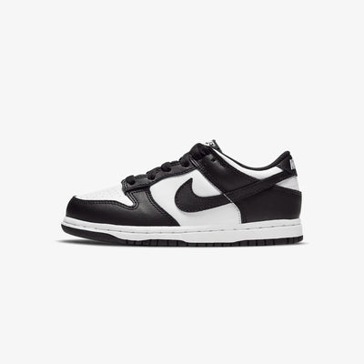 A pair of kids' Dunk Low sneakers in white and black 