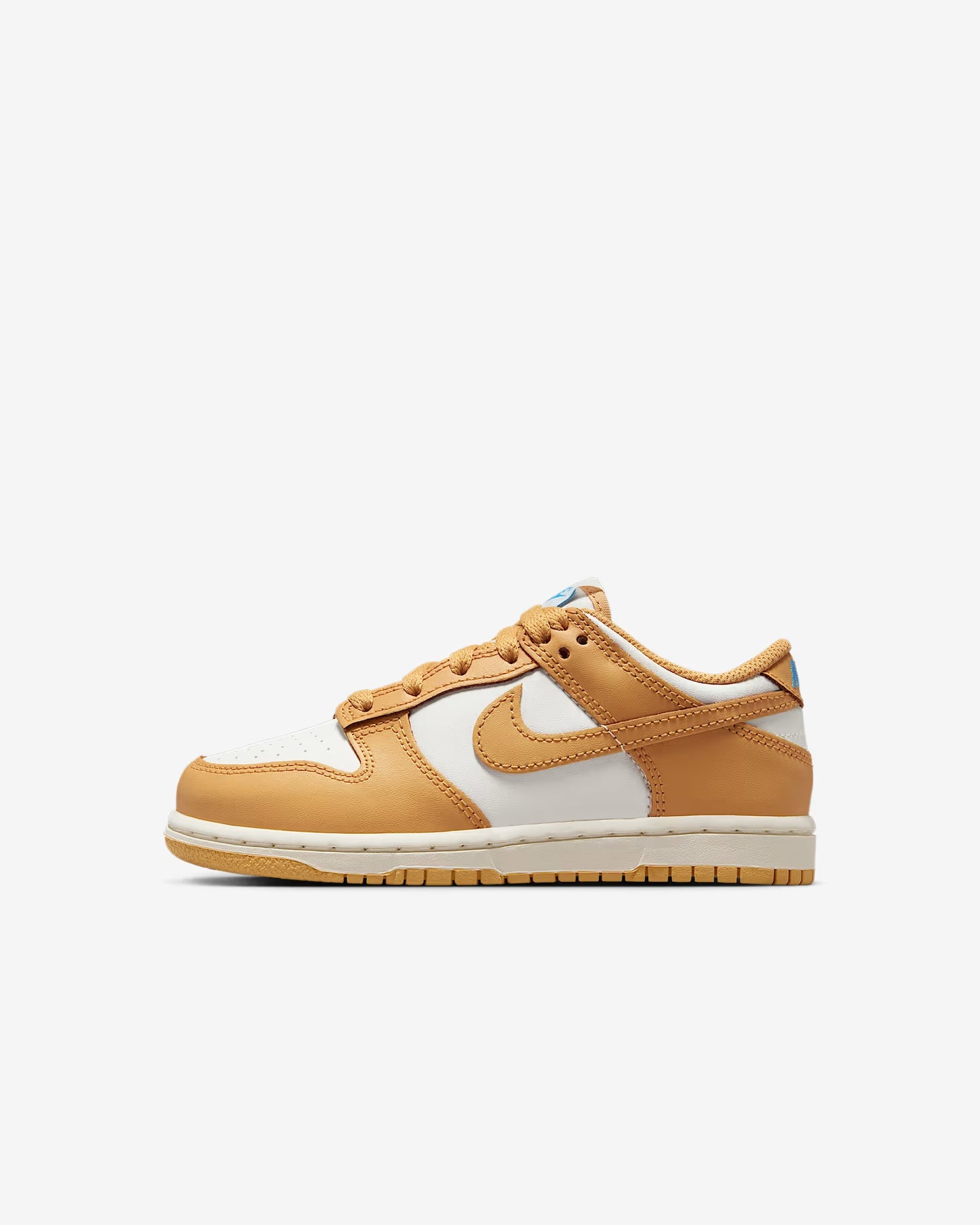 A pair of kids' Dunk Low sneakers in white and orange and blue accents 