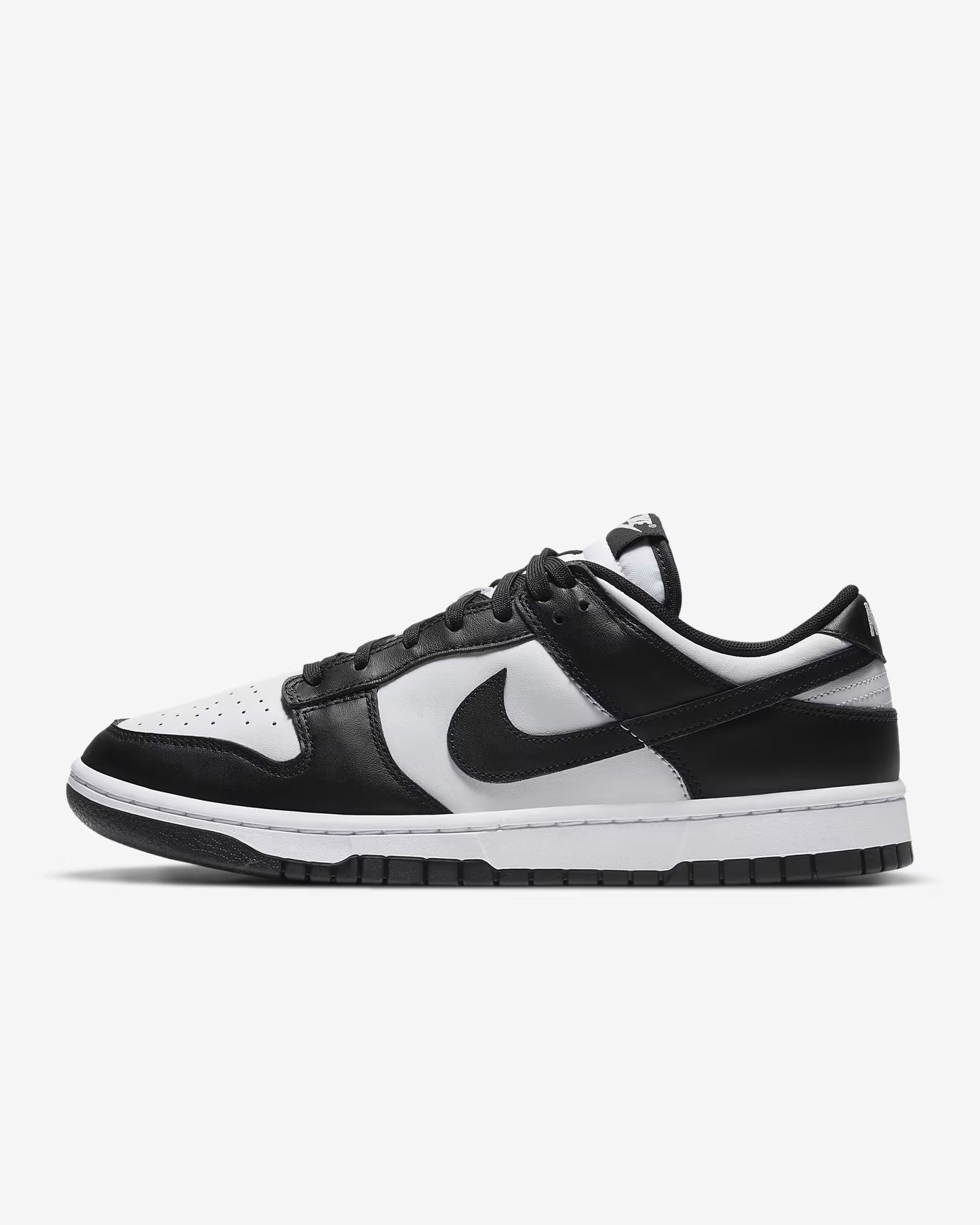 A Dunk Low sneaker with a white and black color scheme
