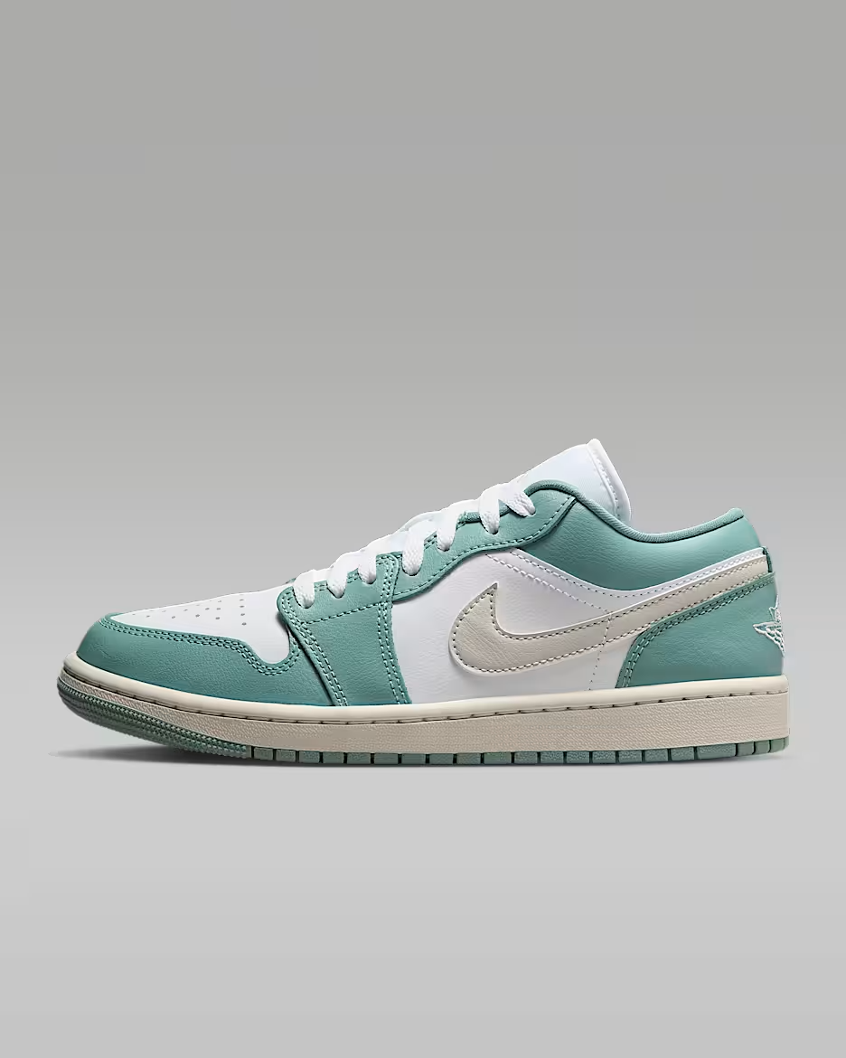 Teal and white sneaker on a gray background