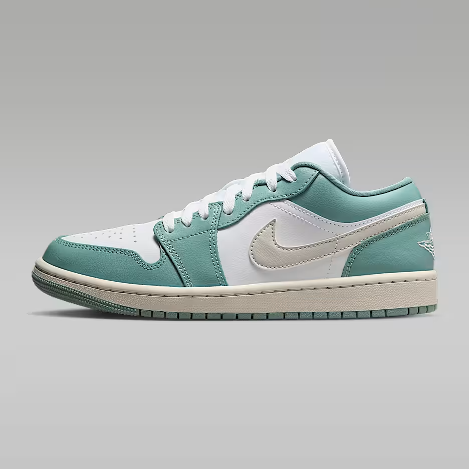 Teal and white sneaker on a gray background