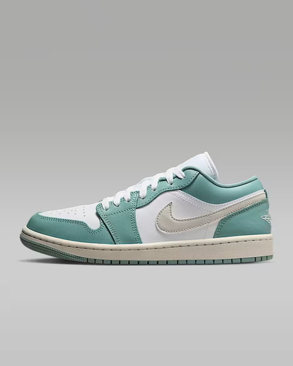 Teal and white sneaker on a gray background