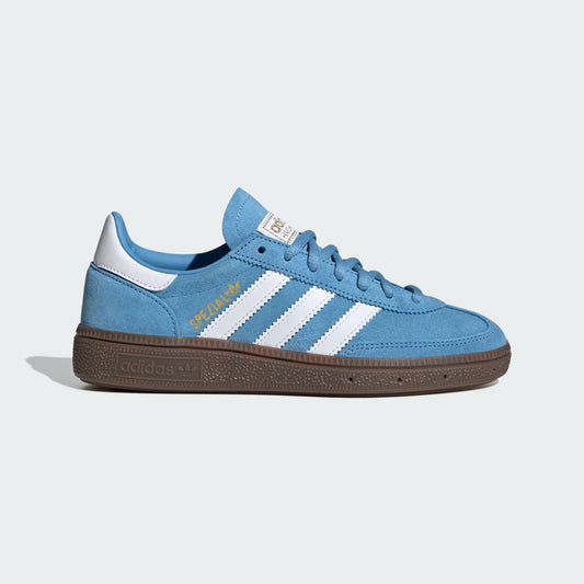 Blue sneaker with white stripes on a light gray background