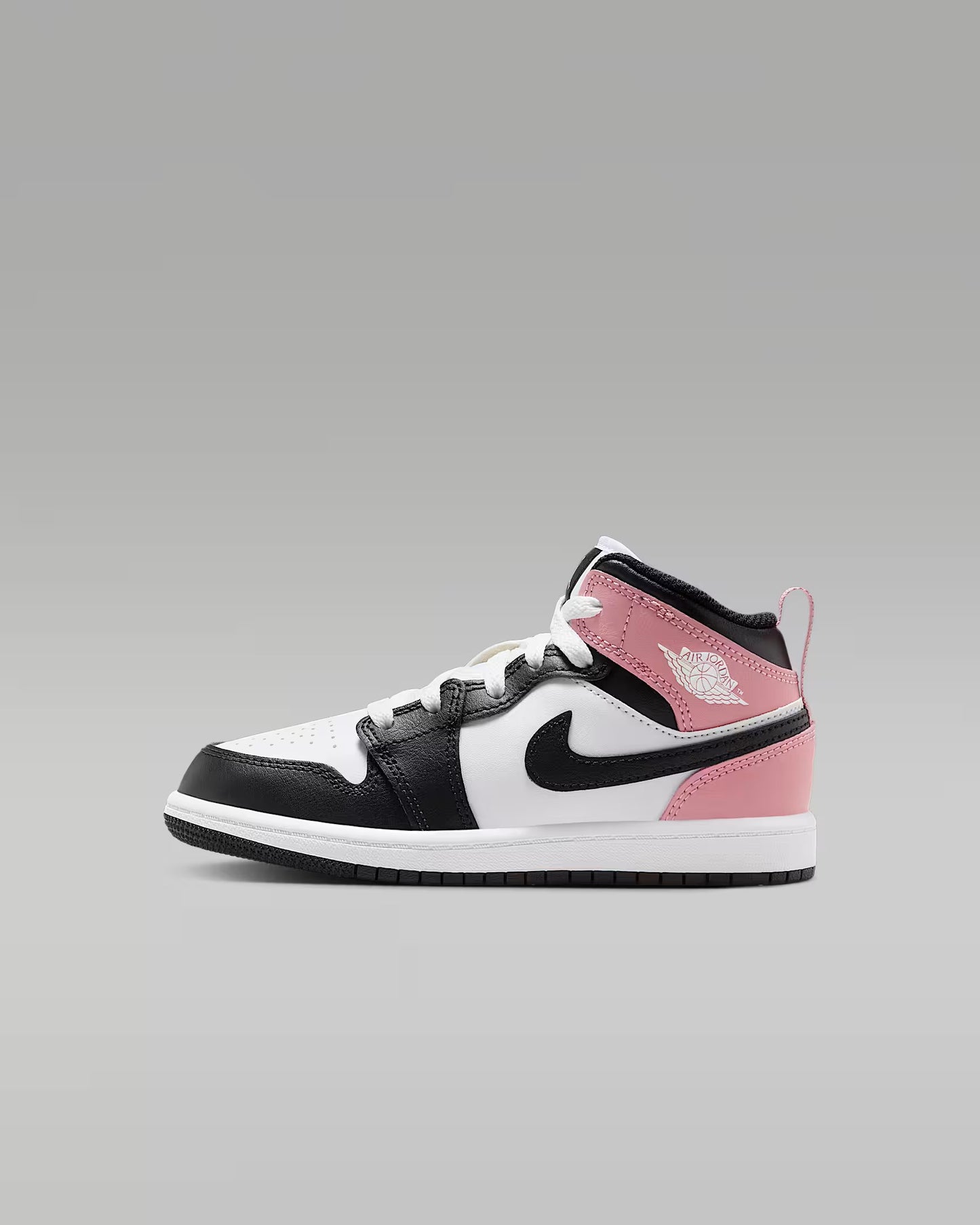 A little kid's Mid top sneaker with a black base color and red details