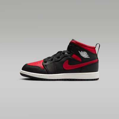 A little kid's Mid top sneaker with a black base color and red details