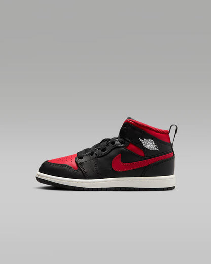 A little kid's Mid top sneaker with a black base color and red details