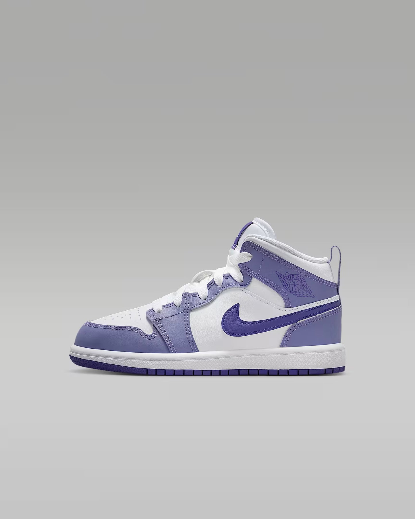 White and purple sneaker on a gray background