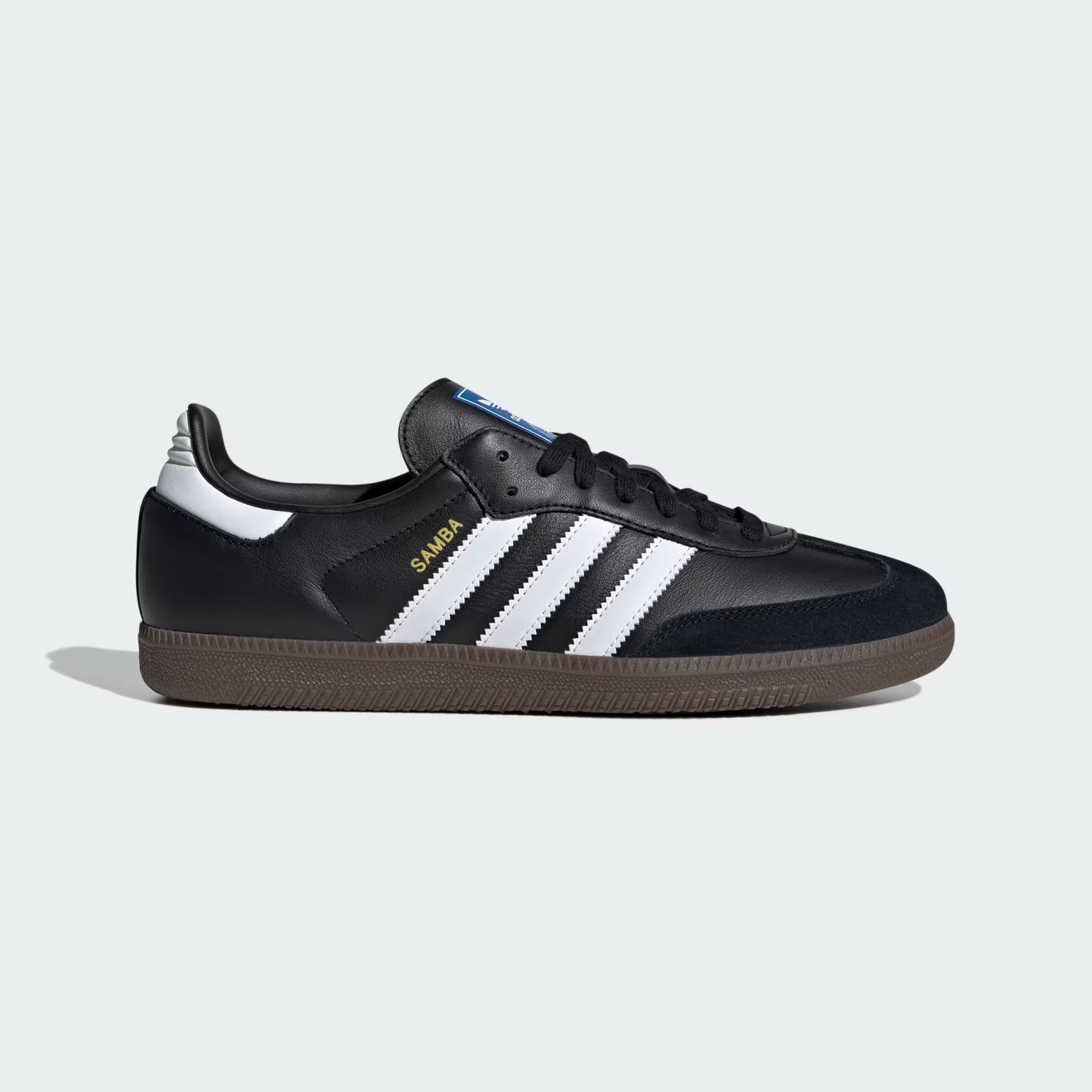 Black sneaker with white stripes on a light gray background