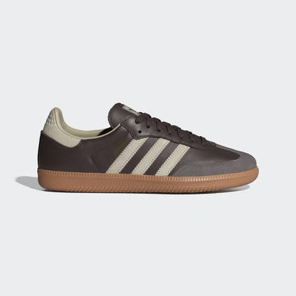 Brown sneaker with white stripes on a light gray background