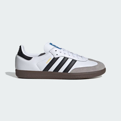 White sneaker with black stripes on a light gray background