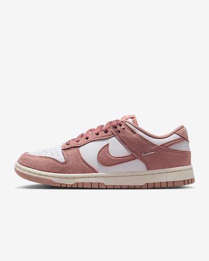 Pink and white sneaker on a white background