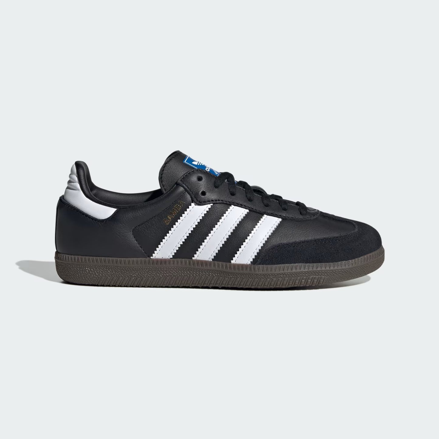 Black sneaker with white stripes on a light gray background