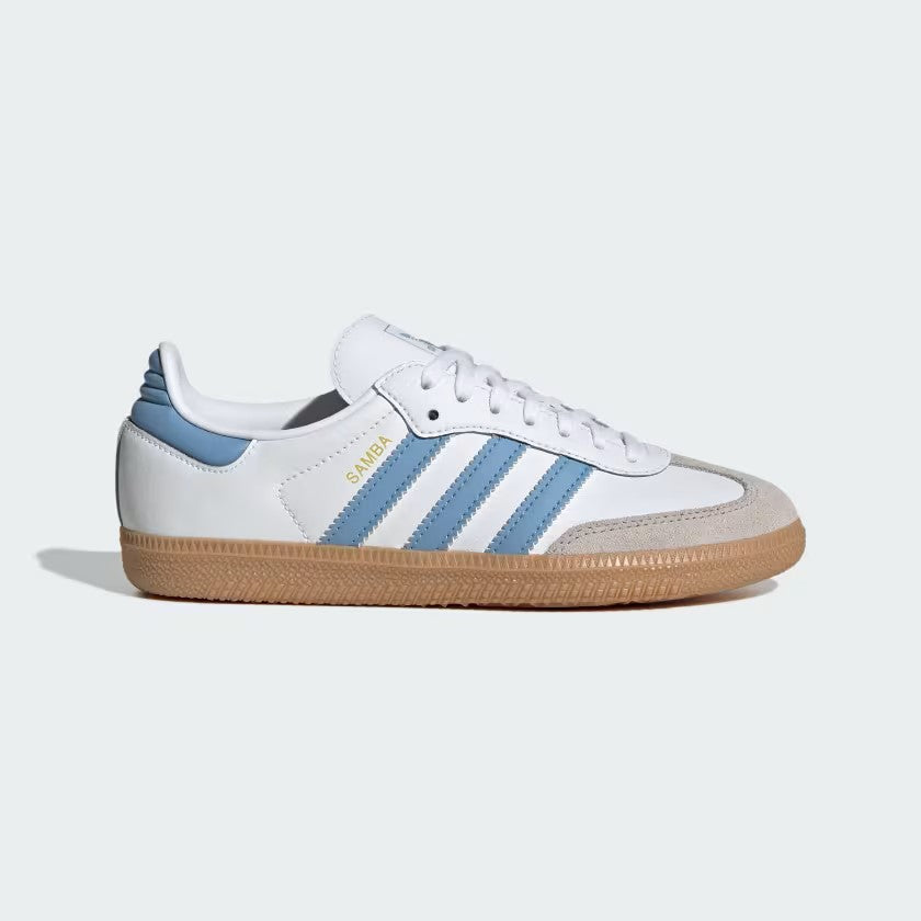 White sneaker with blue stripes on a light gray background