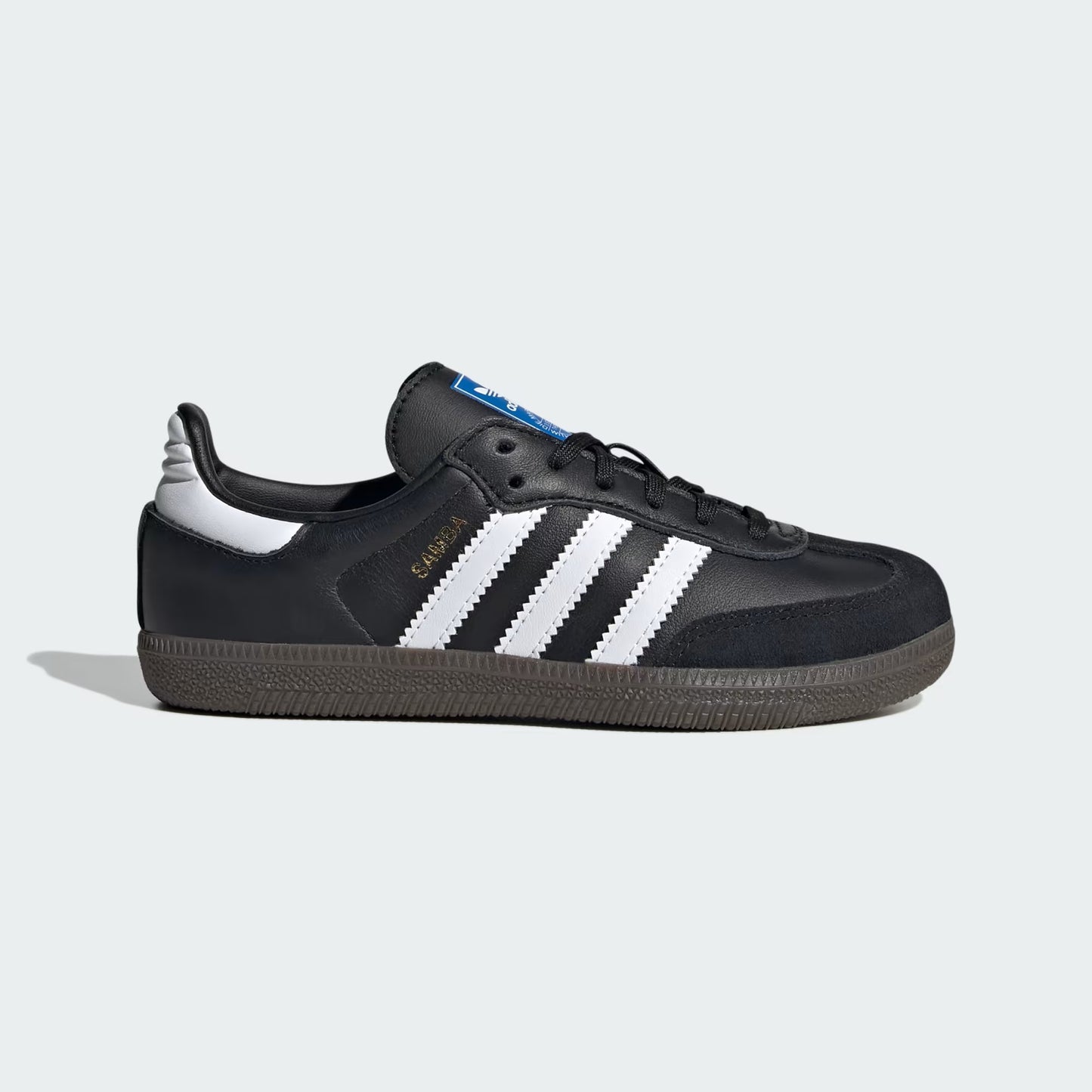 Black sneaker with white stripes on a light gray background