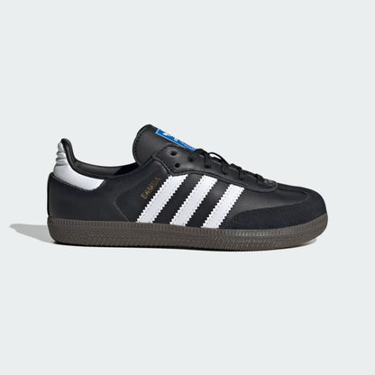 Black sneaker with white stripes on a light gray background