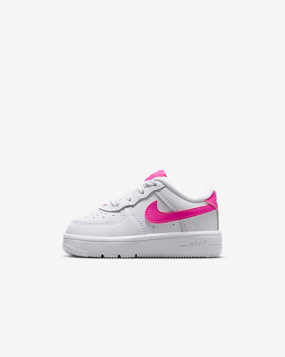 White sneaker with pink accents on a white background
