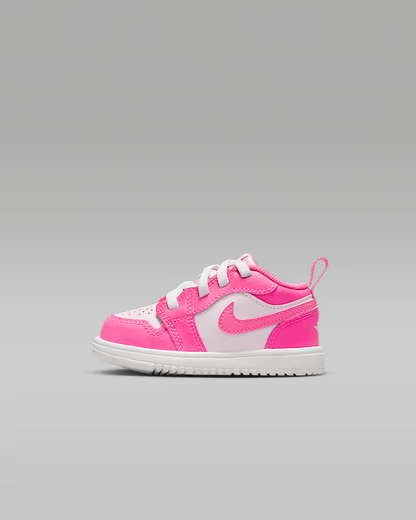Pink and white sneaker on a gray background