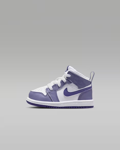 White and purple sneaker on a gray background